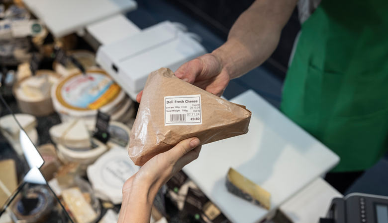 cheese labelling, handing to customer