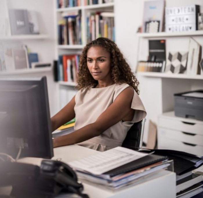 Woman in office working on computer
